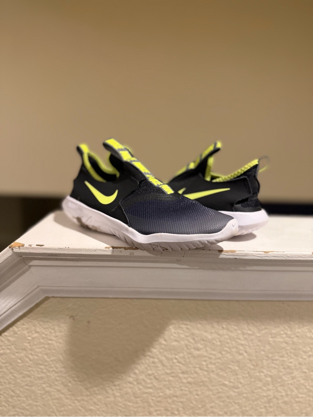 Nike Kids Slip-On Sneakers in Black and Volt